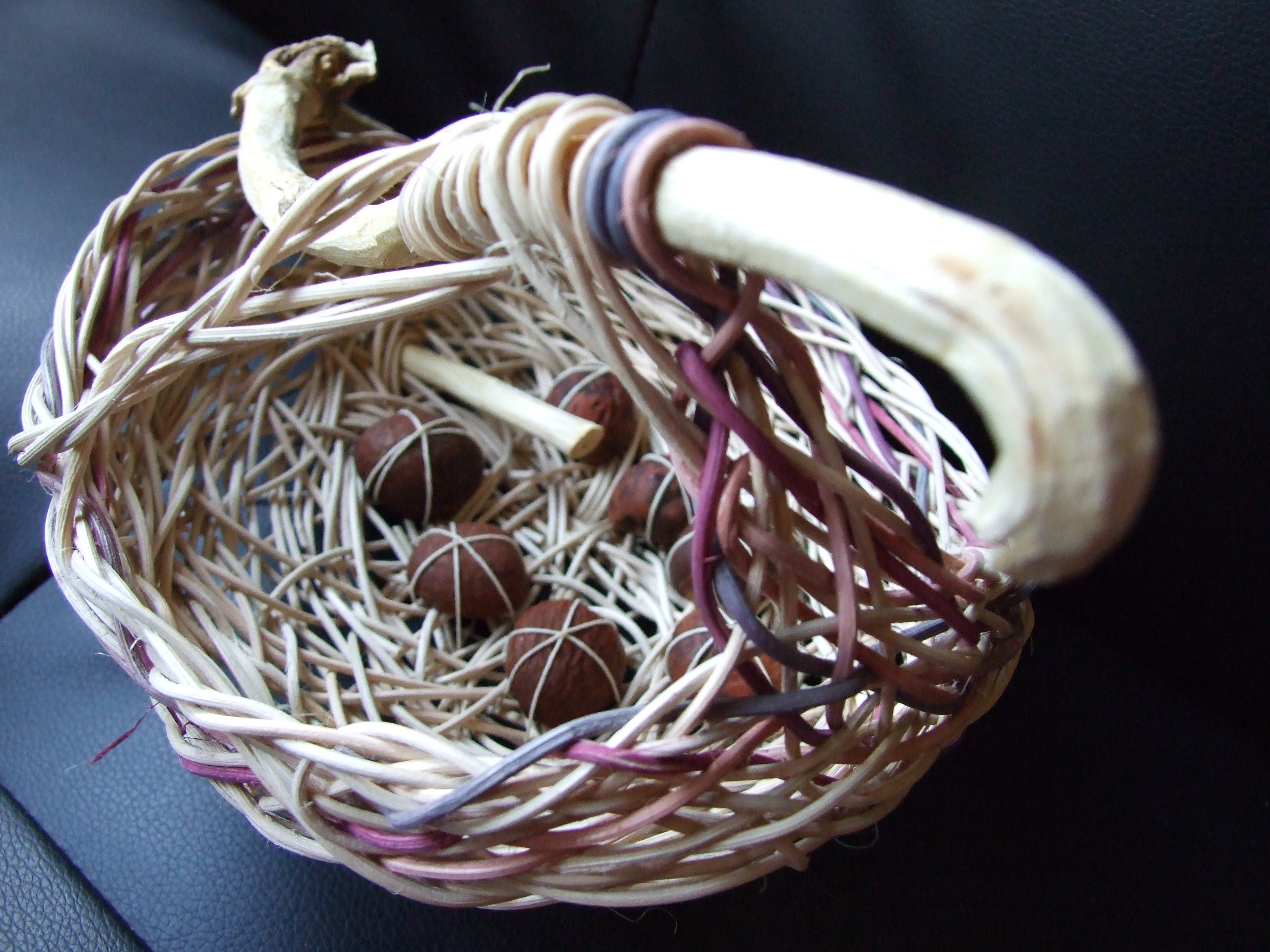 Random weave basket with twig and seeds
